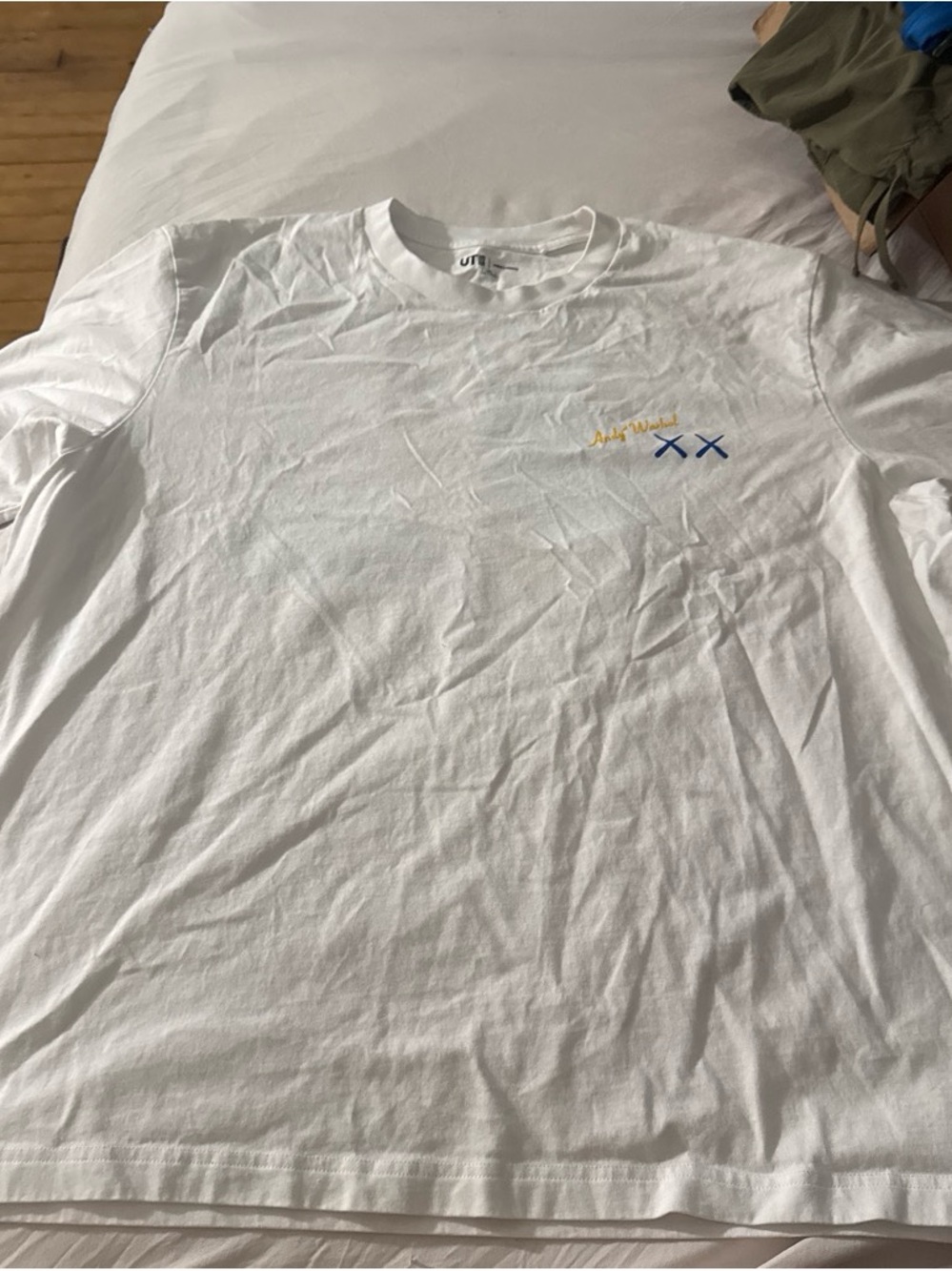 Uniqlo White Long-Sleeve Tee with Blue & Yellow Chest Accent